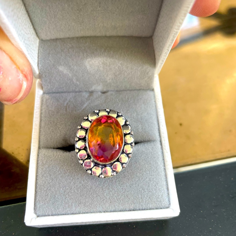 Sterling Silver Plated Pinkish Orange stone. Ring size 6. Unique color.
